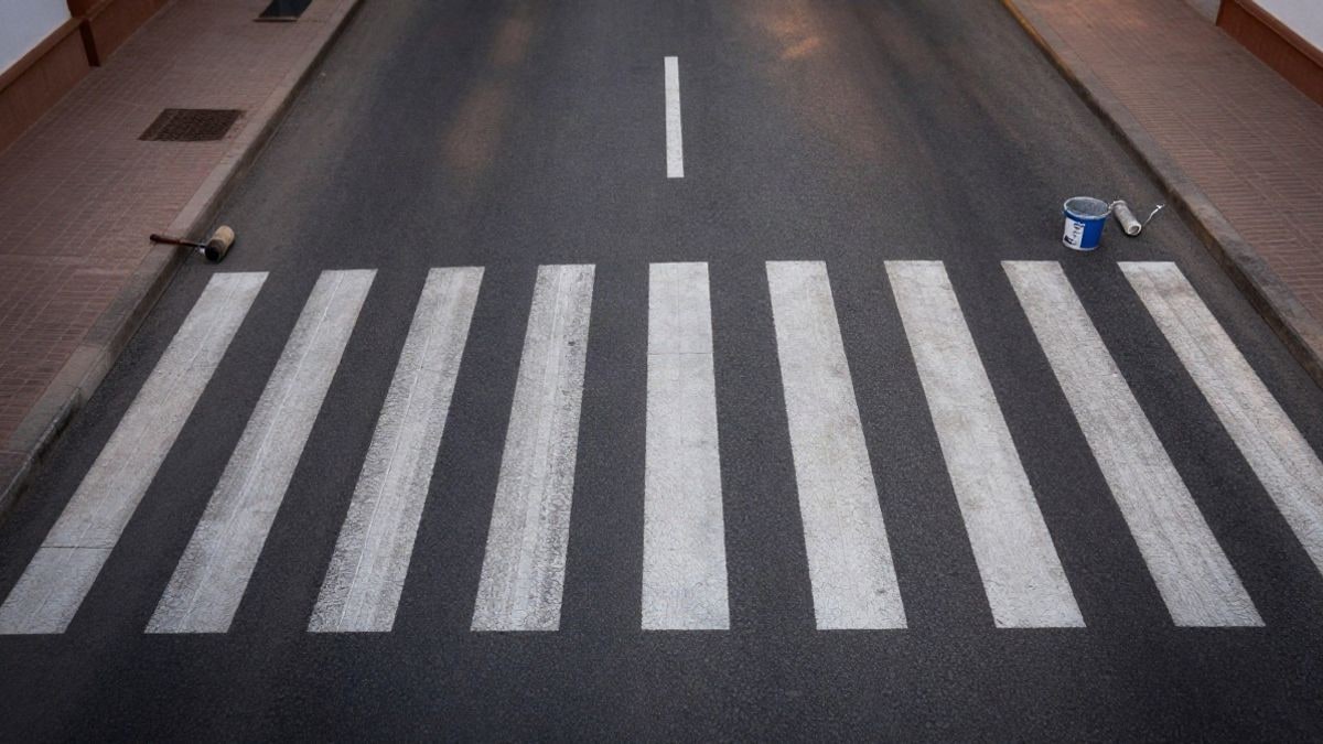 Illustrative image: overhead view of a newly painted pedestrian crossing on an urban street