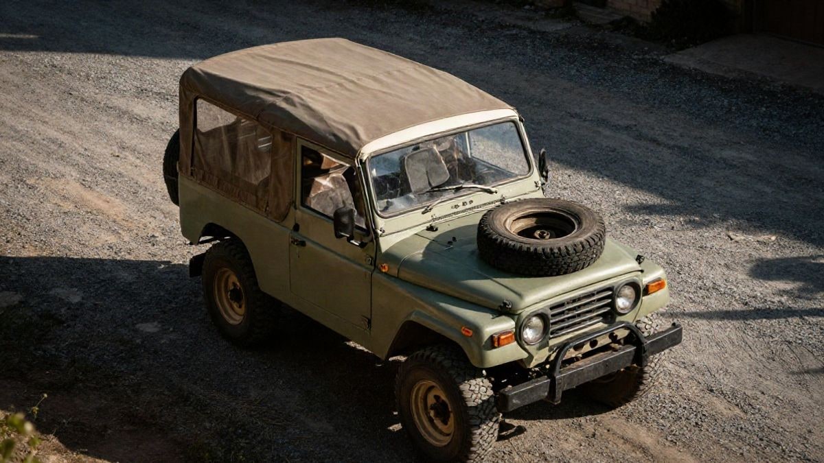 Illustrative image: overhead view of a classic off-road vehicle with a canvas cover over the cargo area and spare wheel on the hood