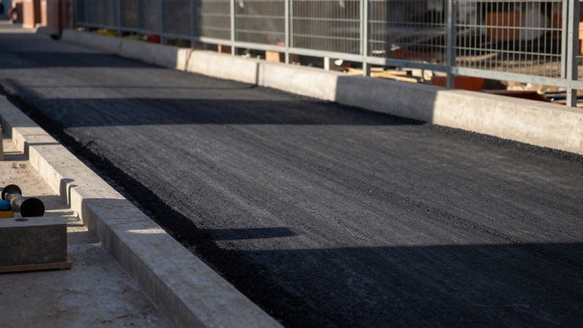 Illustrative image: detail of construction materials and pavement on a street under construction