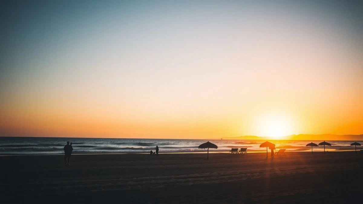 Illustrative image: a Mediterranean beach at sunset, with calm sea and a wooden pier in the background.