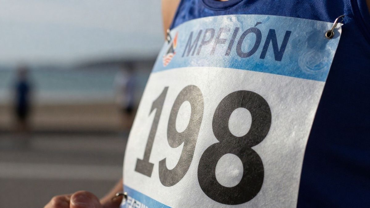 Illustrative image: close-up of a race bib on a sports t-shirt