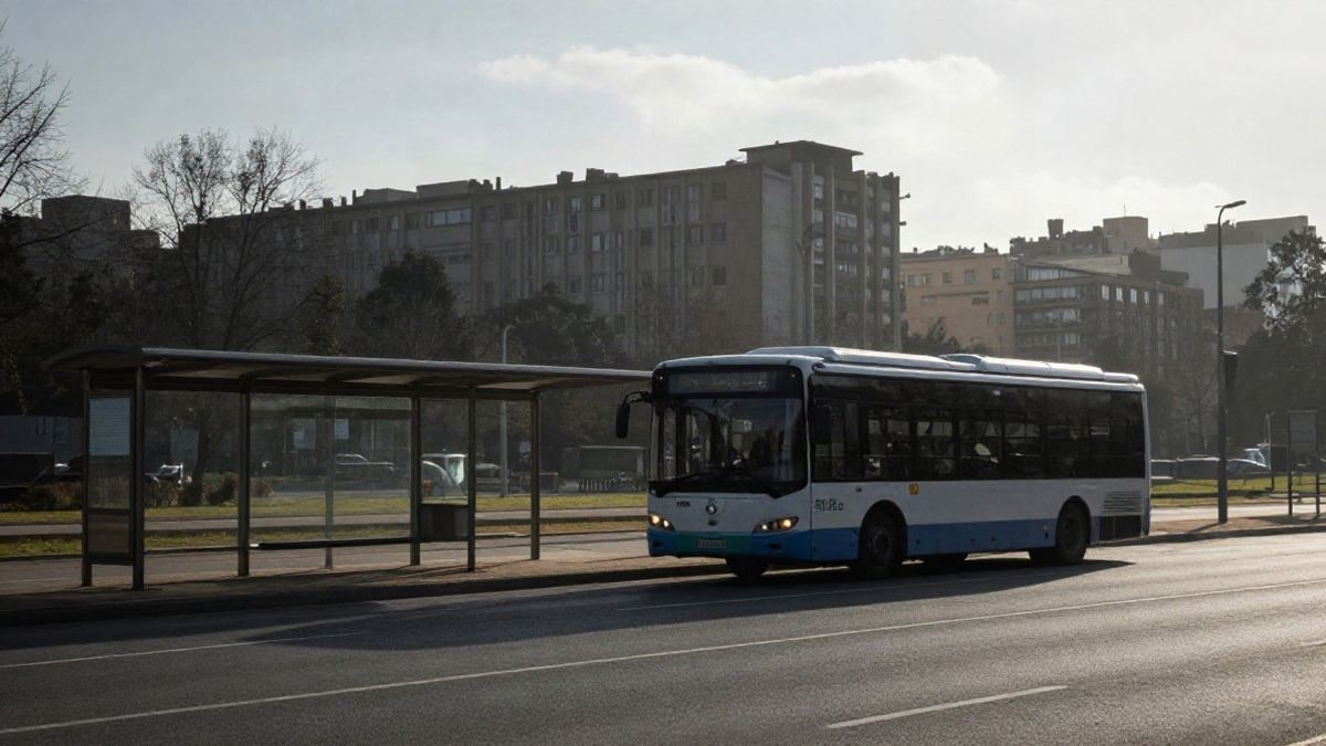Illustrative image: an urban bus at an empty stop with a university campus in the background