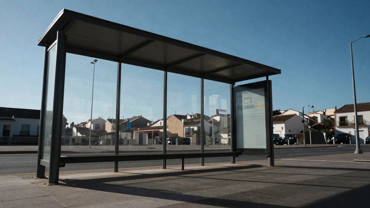 Imagen ilustrativa: marquesina de autobús vacía vista desde abajo con el cielo azul de fondo